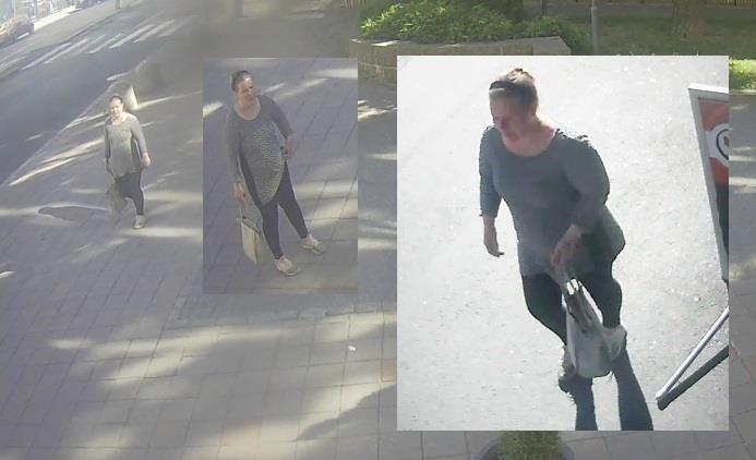 något suddig bild på kvinna som rör sig med väska på stan