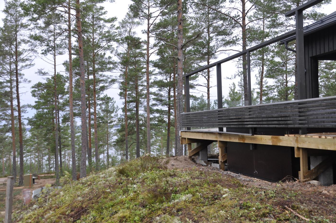 Husverranda som vetter mot stranden