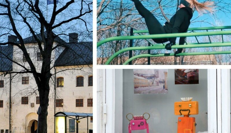 Åbo slott, idrottande gymnast och två små robotar i skyltfönster