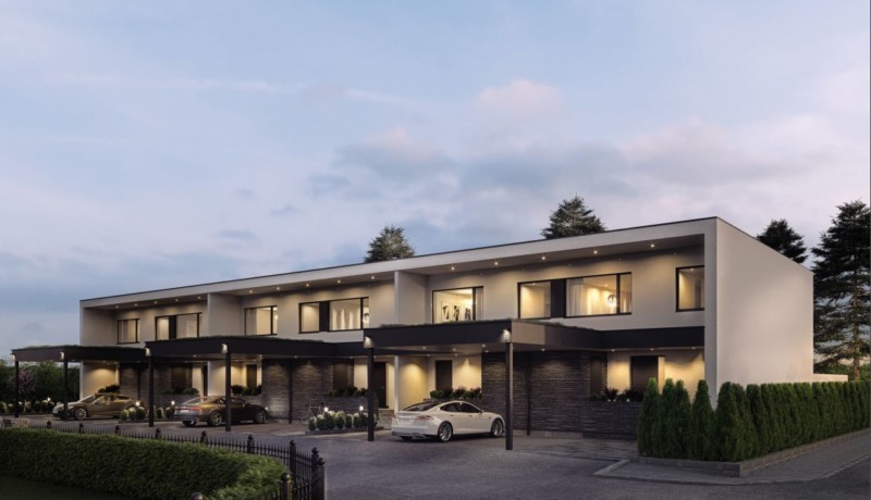 visionsbild av nytt radhus med lampor tända i fönstren
